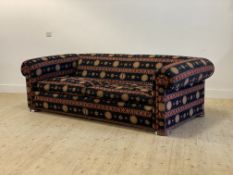 Duresta, a large three seat chesterfield sofa, upholstered in a chenille type fabric with sunburn