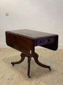 A mid 19th century mahogany breakfast table, double drop leaves over drawer opposed by a dummy,