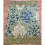 A Kashmiri hand chain stitched wool panel with floral motifs on a green field 175cm x 122cm