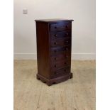 A Victorian style mahogany bow front chest fitted with seven drawers, raised on bracket supports