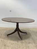 A Regency style brass inlaid mahogany breakfast table, the oval snap top over ring turned column and