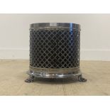 A Regency design steel waste paper bin of cylindrical outline, the latticed case with rosette motif,