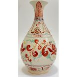 A Chinese/Japanese earthenware vase with polychrome decoration depicting scrolling floral motifs and