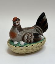 A ceramic hand-painted hen nesting egg holder. (w- 21cm h-18cm) ( chips to base rim)