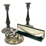 A pair of 19thc Sheffield plated candlesticks with acanthus leaf chased tops on tapered fluted