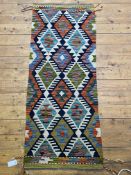 A Chobi Kilim runner rug of typical design, 148cm x 60cm