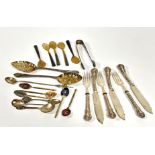 A collection of flatware including a set of five horn egg spoons, pair of Epns chased berry