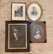 A group of four early late 19th/early 20thc large framed portrait photographs, two of a young