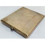 A Continental 935 marked silver/argentium cigarette case with blue pusher, engine turned pattern and