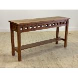 A contemporary stained teak console table, with slatted frieze raised on square section supports