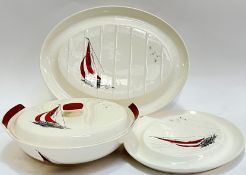 A group of Palissy "Regatta" pattern dinnerware decorated with red sailboats comprising a lidded