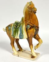 A Chinese pottery Tang style horse decorated with honey and coloured glaze, (H x 35cm x L 30cm x W