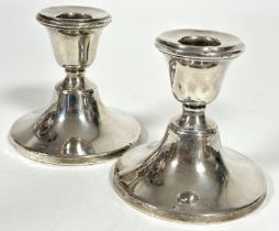 A pair of Birmingham silver desk style candle sticks o circular weighted bases, (H x 9.5cm) marks