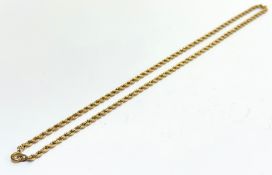 A yellow metal rope twist pattern necklace with circular clip fastening, (L x 22cm) tested as high