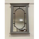 A traditional grey painted hardwood wall hanging mirror, with fluted pilasters flanking a mirrored