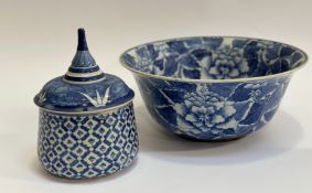 A large blue and white, lotus vine decorated decorative bowl (w-32cm h-14cm) and a blue and white