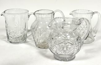 A Edinburgh crystal baluster slice cut water jug, (H x 16cm) and three crystal slice cut water jugs.