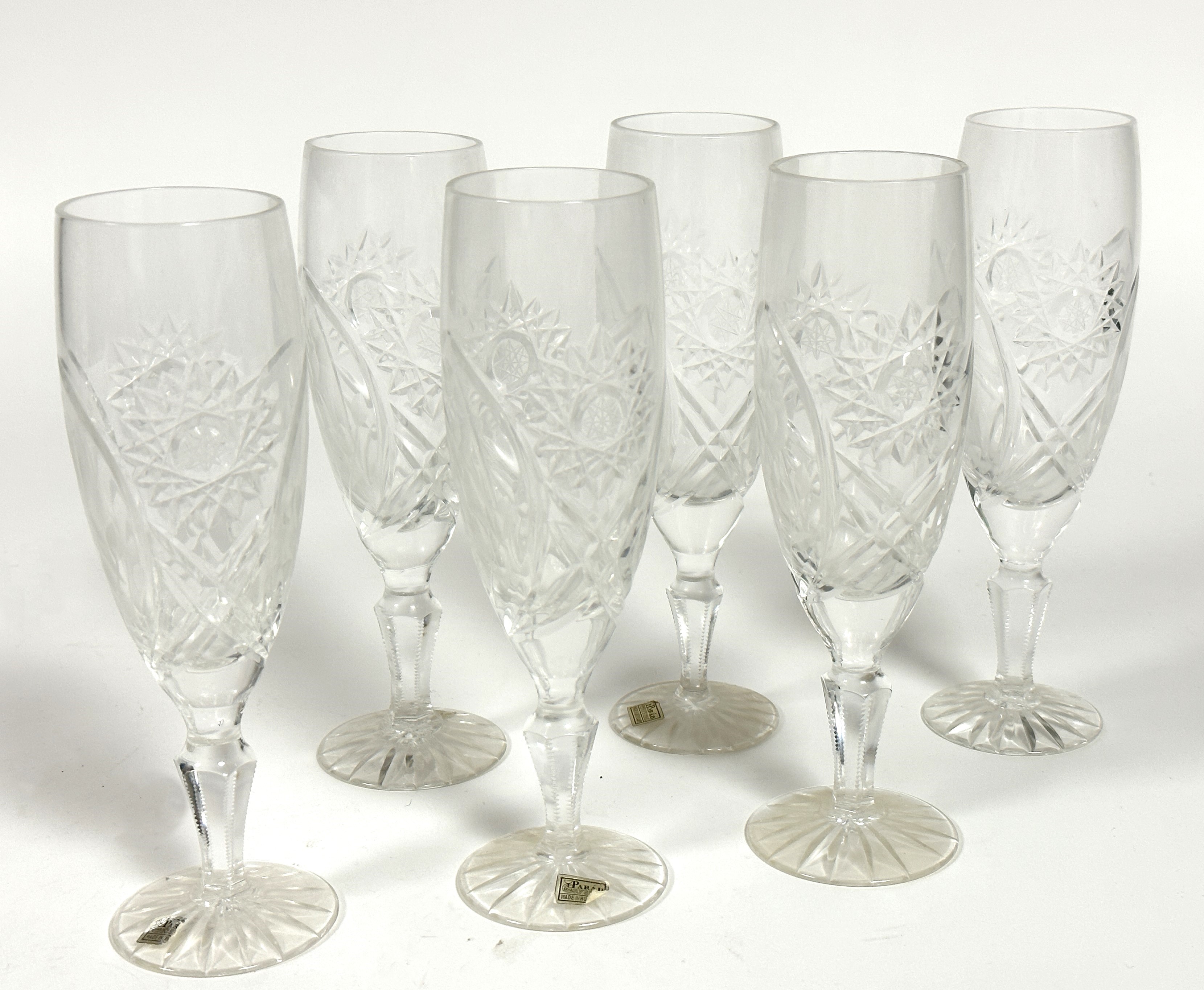 A set of six Parad Hungarian crystal slice cut Champagne flutes raised on faceted baluster stems and