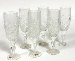 A set of six Parad Hungarian crystal slice cut Champagne flutes raised on faceted baluster stems and