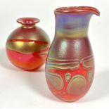 A Phoenician Maltese glass red/orange iridescent overlaid jug, signed verso, (Hx12.5cm) and a ball