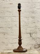 A Georgian style walnut table lamp base, turned base under waterleaf and reeded carved column H53cm