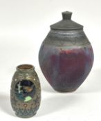 A modern Art Pottery ovoid vase with domed cover with drip scroll design and similar border, with