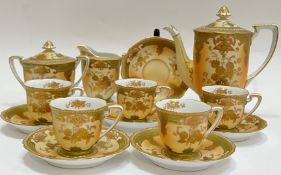 A Noritake blush china part tea set decorated with raised gilt comprising five cups, six saucers,