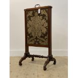 A mid 19th century mahogany metamorphic fire screen, three sliding embroidered silk lined panels,