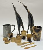 A collection of various cow horn items comprising three beakers (tallest h-12.5cm smallest h-6cm),