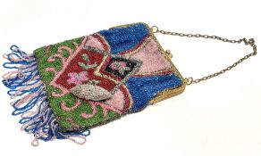 A 1920's-30's gilt metal evening bag with hand stitched panel design to front and and back with