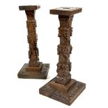 A pair of Edwardian Arts and Crafts style oak candle sticks, the rectangular tops raised in square