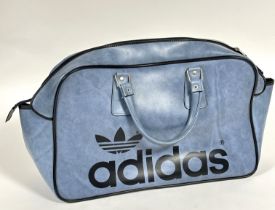 A Adidas vintage 1970's blue vinyl twin handled sports bag with zip closure to top and metal stud