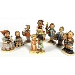 A collection of eight Hummel German pottery figures including, Cinderella, Friends Together, Be