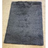 A Contemporary synthetic deep pile grey rug