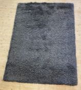 A Contemporary synthetic deep pile grey rug