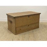 A Victorian pine mule chest, the hinged top opening to an interior with two drawers and a candle