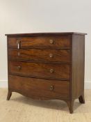 A Regency mahogany bow front chest, fitted with four long graduated drawers having ebonised string