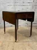 A George III mahogany pembroke table, the top with two drop leaves, above a drawer to one end,