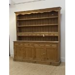 A Victorian style pine dresser, the three height plate rack fitted with five spice drawers, above