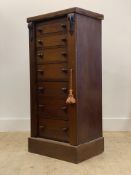 A Victorian mahogany Wellington chest of characteristic form, with acanthus carved corbels