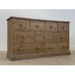 A Victorian style multi drawer chest, fitted with nine drawers, raised on a skirted base (a/f)