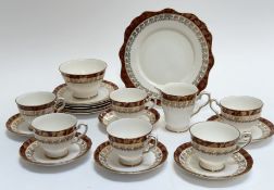 A Royal Staffordshire, Morning Glory red and gilt pattern tea service comprising a serving dish (w-