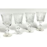 A set of four large slice cut crystal red wine glasses on knop stems and slice cut bases, (H x
