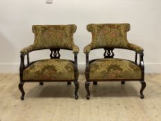 A pair of late Victorian horse shoe back upholstered chairs standing on cabriole supports H73cm