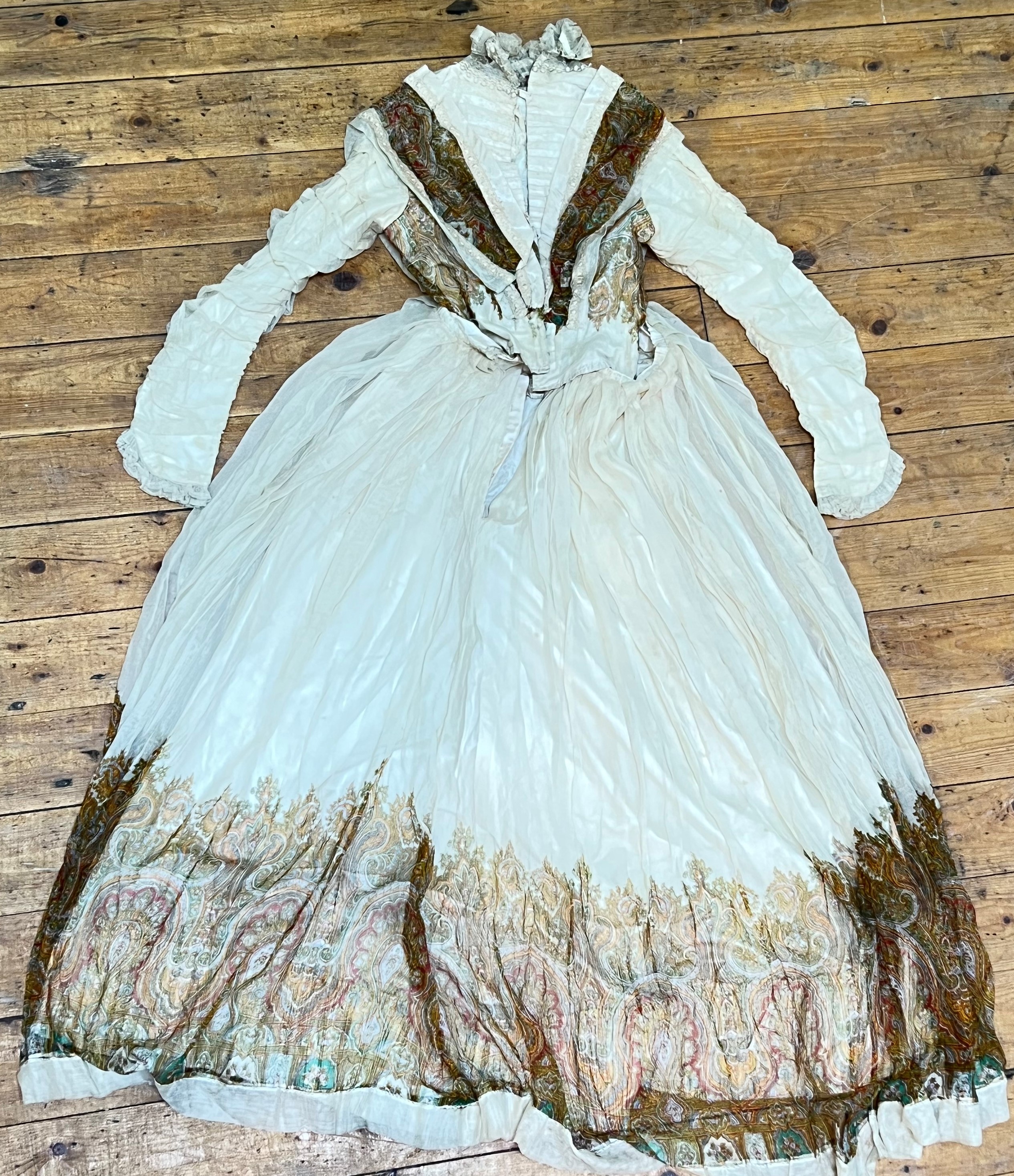 A Victorian two-part ball-gown/dress with brightly coloured embroidery and silk edges (l- 154cm)