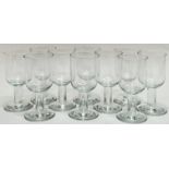 A set of 10 clear drinking glasses on with wide foot and stem (h- 13cm)