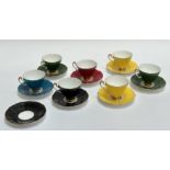An Adderley Bone China group of various coloured tea cups and saucers comprising of yellow, red,