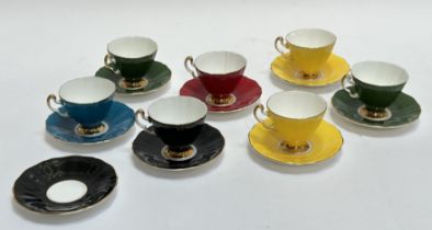 An Adderley Bone China group of various coloured tea cups and saucers comprising of yellow, red,