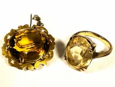 A 9ct gold scrolling engraved open work brooch set oval faceted citrine mounted in claw setting (