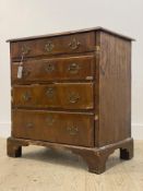 An 18th century walnut chest of small proportions, the top with moulded edge above four cross banded